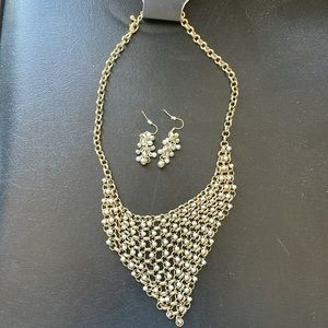 Bib style silver and gold mesh necklace and earrings. Statement & classy.